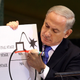 2012: Netanyahu discusses concerns about Iran’s nuclear capabilities at a UN summit, flaunting a visibly thickened and fastidiously combed ‘do. (Image via Associated Press)